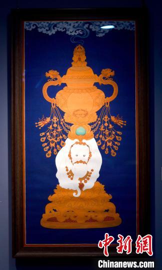 圖為5月16日，展覽中的新創(chuàng)唐卡作品《瑞象承香》?！±盍?攝